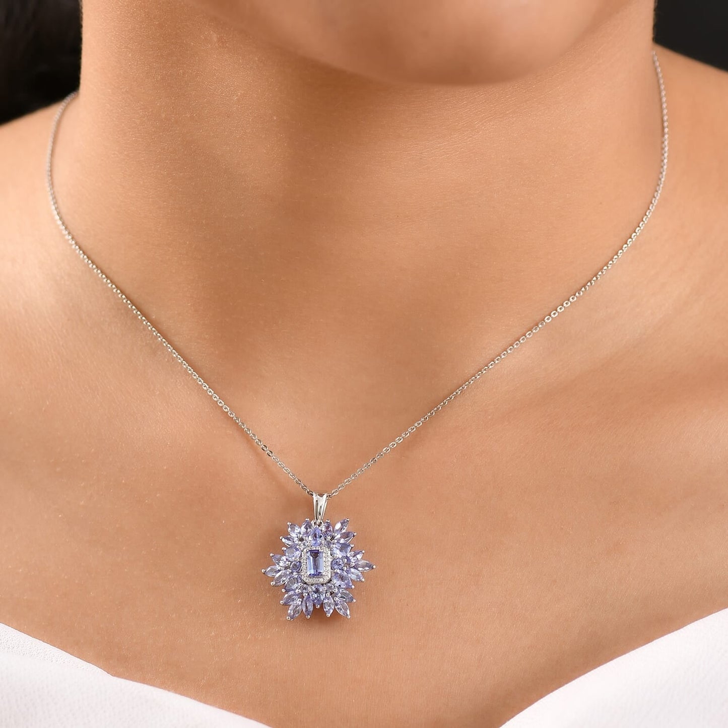 Tanzanite & White Zircon Pendant – Floral Elegance in Rhodium Silver