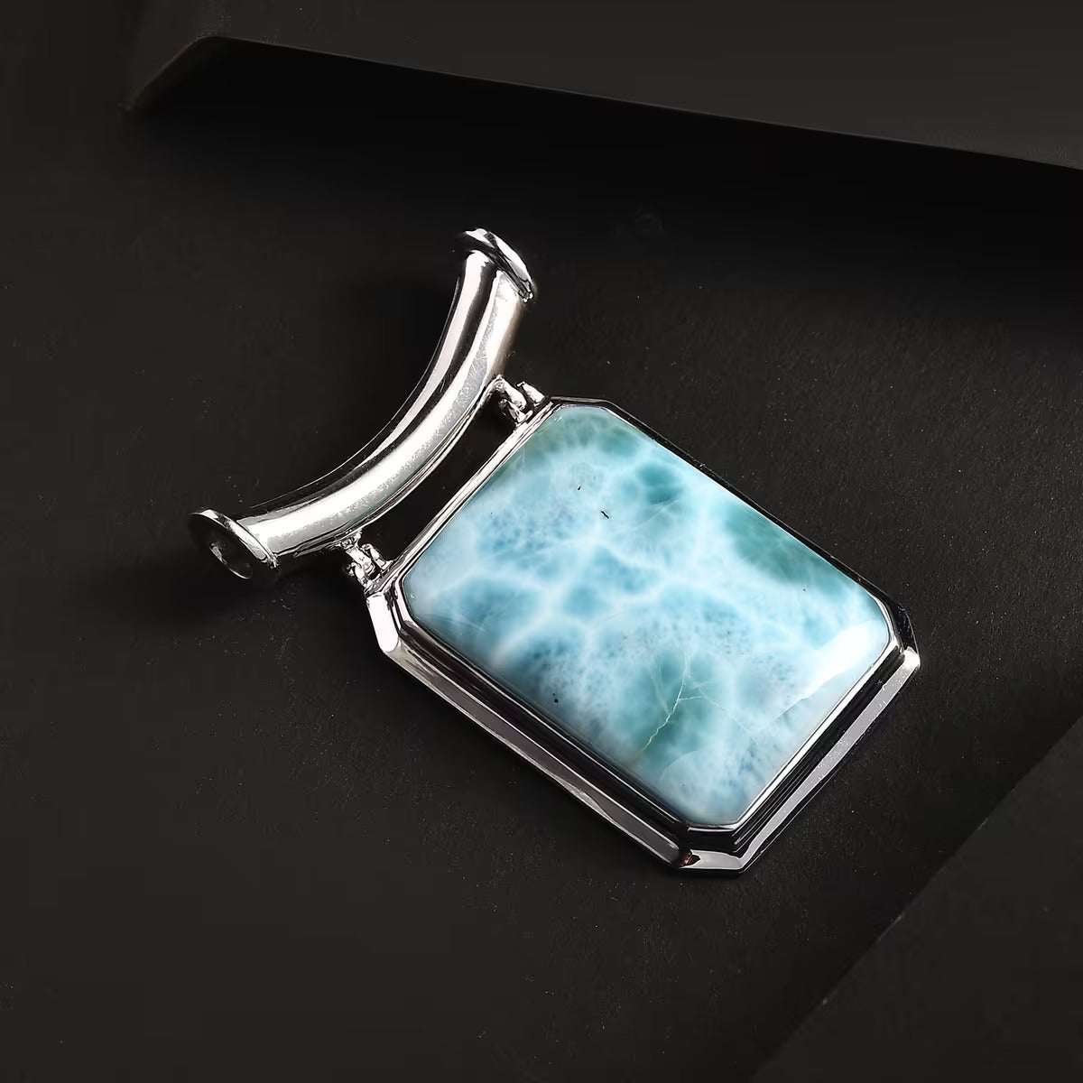 Larimar Solitaire Pendant in Rhodium Over Sterling Silver – An Emblem for Peace