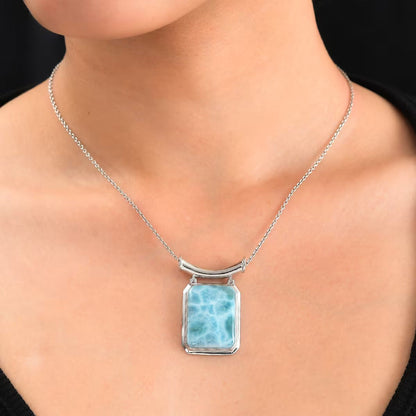 Larimar Solitaire Pendant in Rhodium Over Sterling Silver – An Emblem for Peace