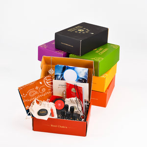 Colorful gift box set with various items on a white background